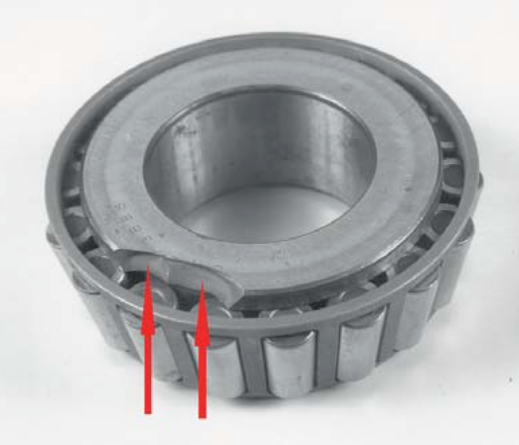 Figure 2. Overload fracture of the inner ring flange of a tapered roller bearing caused by impact load during the assembly process..png Figure 2. Overload fracture of the inner ring flange of a tapered roller bearing caused by impact load during the assembly process..png