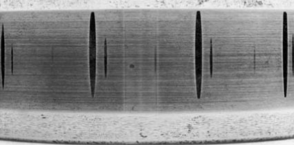 shows pseudo-indentations on the inner ring of a cylindrical roller bearing, distributed according to the rolling element spacing.  .png
